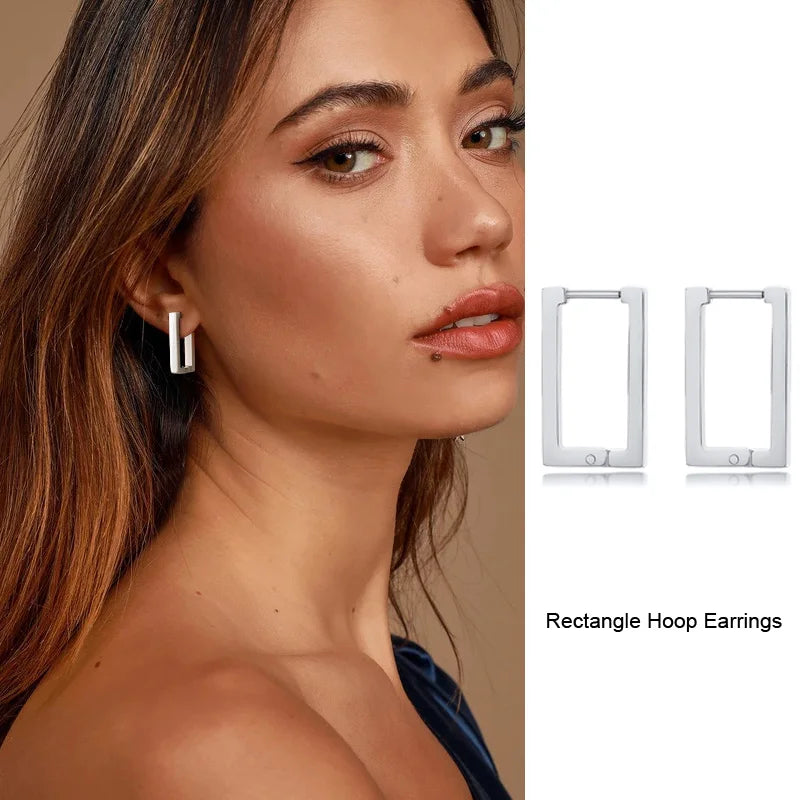 Silver rectangular hoop earrings shown worn and in a front view