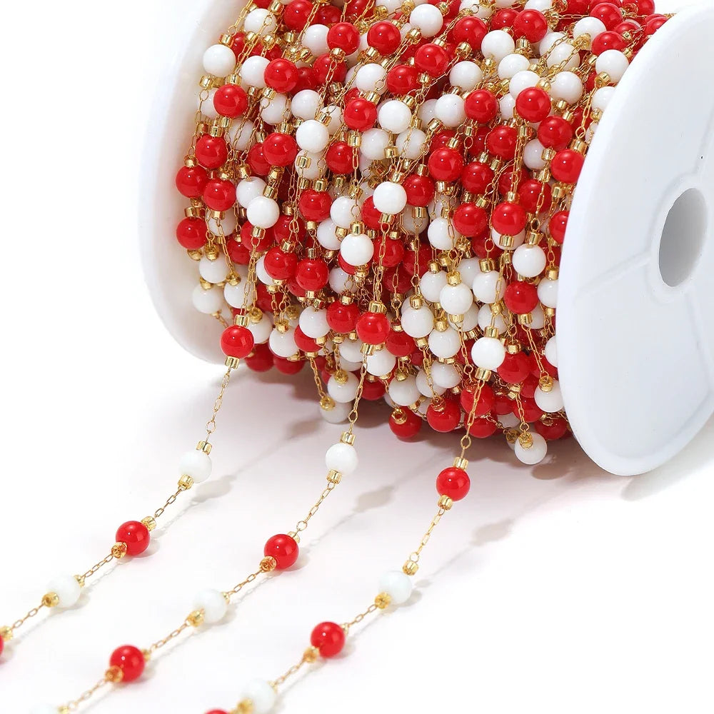 Red and white bead chain with gold-tone links and round pearl-like and red beads