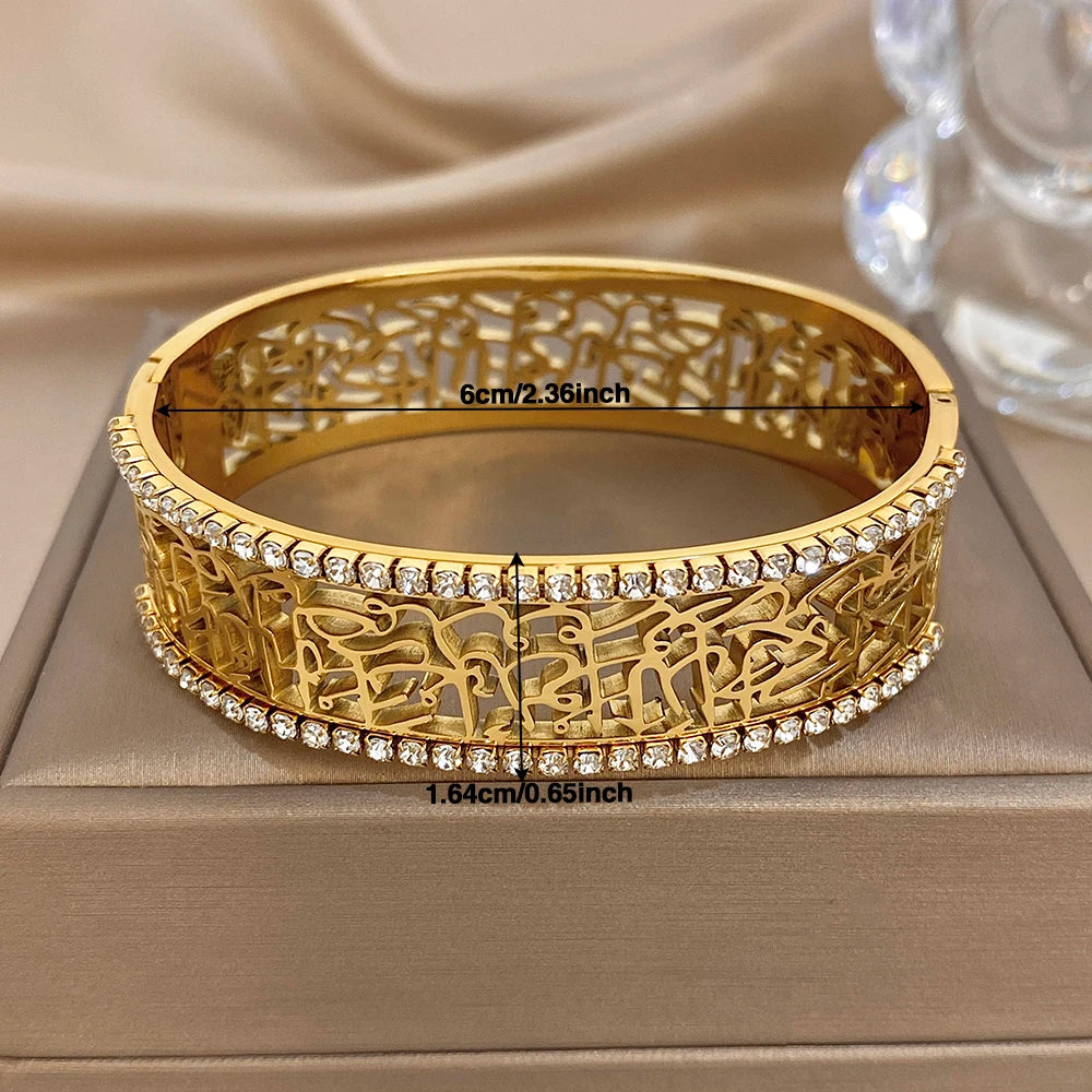Gold-tone cuff bracelet: 6cm and 1.64cm width, hollow geometric engraving, rhinestone border