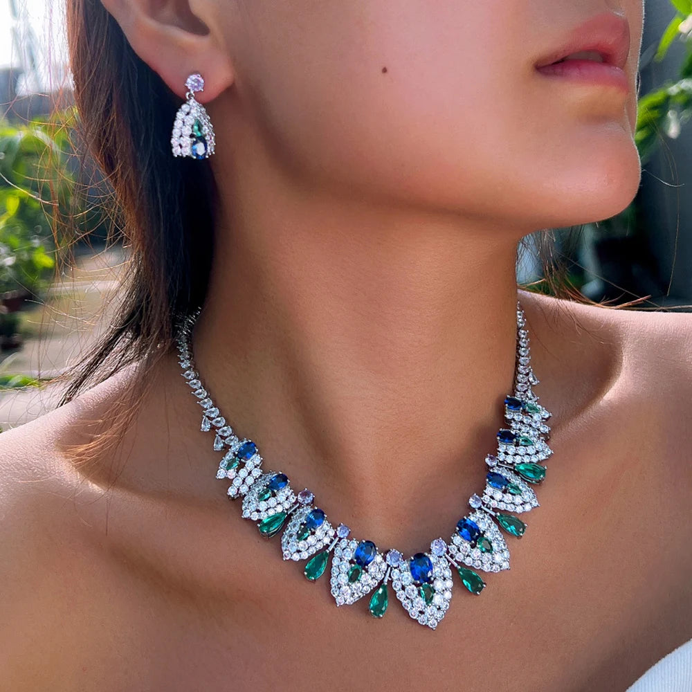 Blue and green stone necklace and matching teardrop earring worn on a model