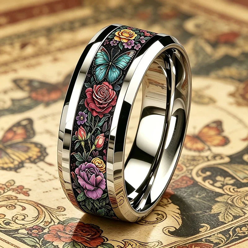 Side view of floral butterfly stainless steel ring, black band with gold-tone inside