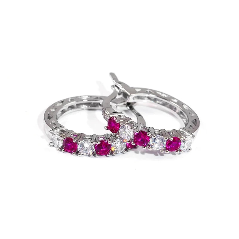 Silver circle hoop earrings with magenta gemstones and clear accents