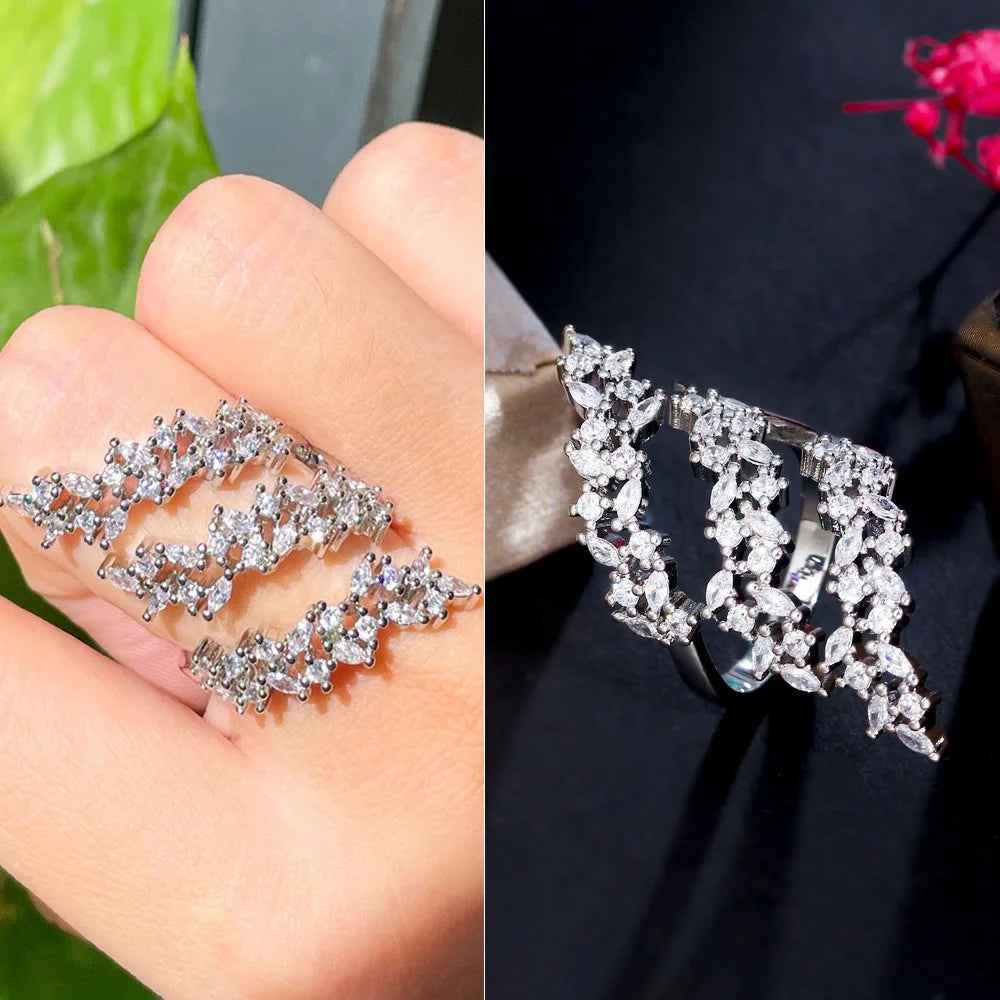 Silver-tone adjustable ring with three wavy rows of clear clustered stones