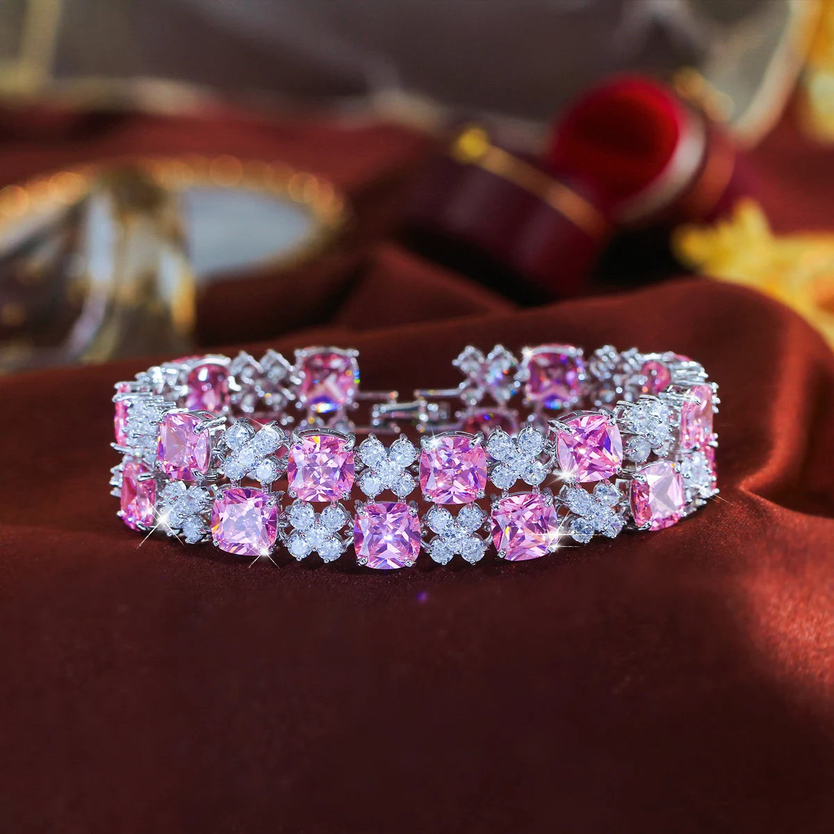 Pink and clear cubic zirconia flower tennis bracelet shown fastened