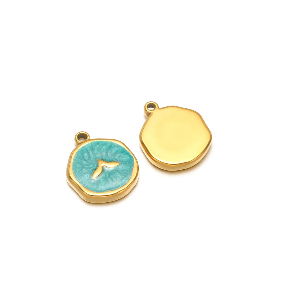 Pair of enamel ocean charms: yellow shell charm and teal seashell charm with gold fish