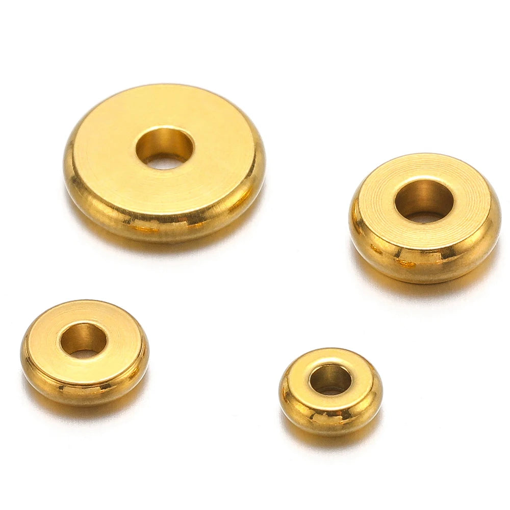 Gold round flat spacer beads set, visible center holes and stacked bead sizes