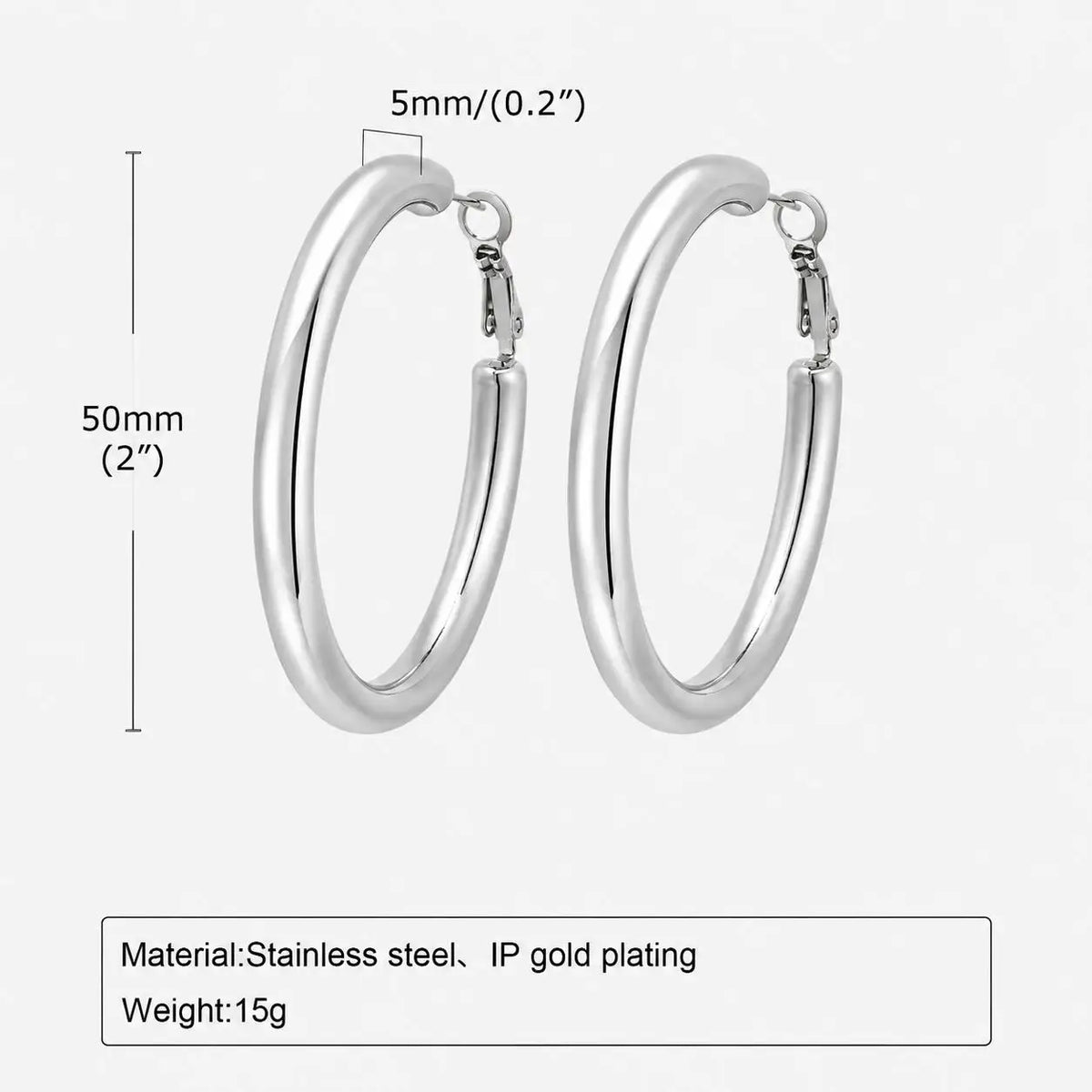 Silver-tone chunky hoop earrings, 50 mm tall and 5 mm wide, with hinged clasps