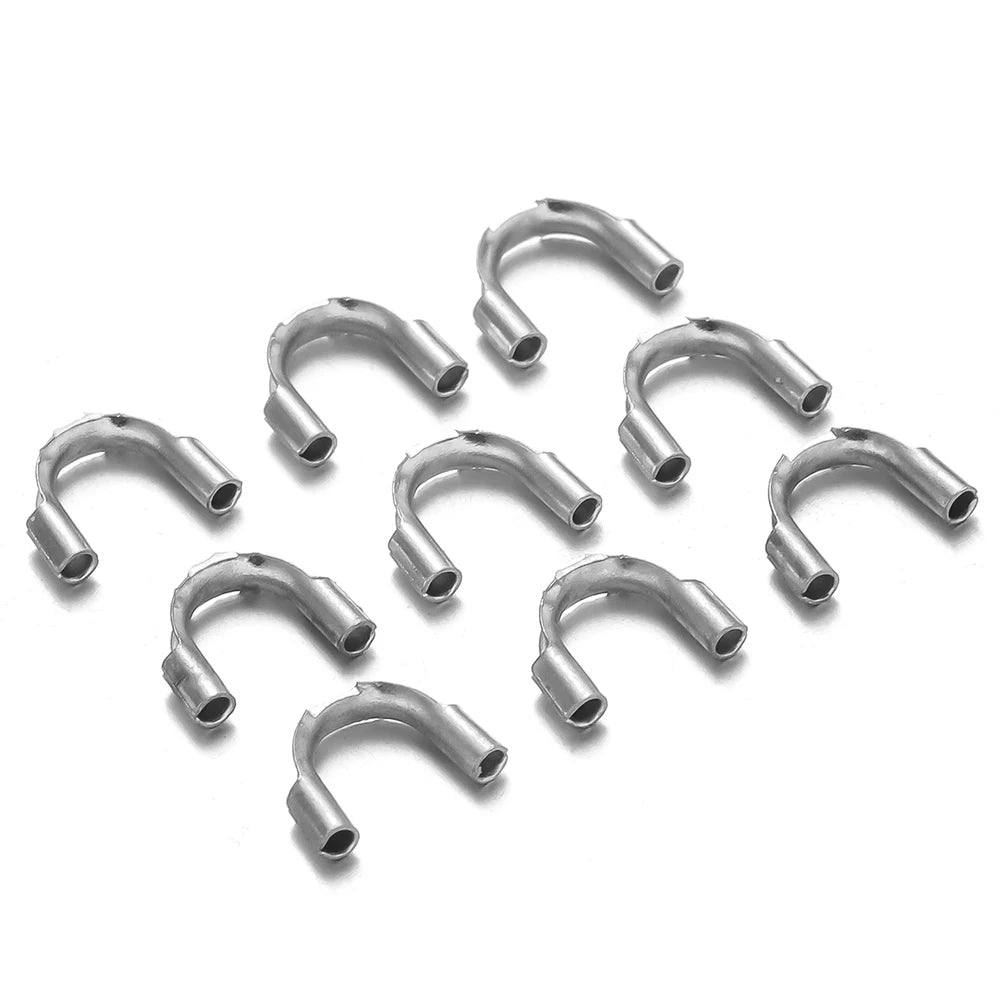 Stainless steel U-shaped wire guard clasps, small connector pieces in a pile