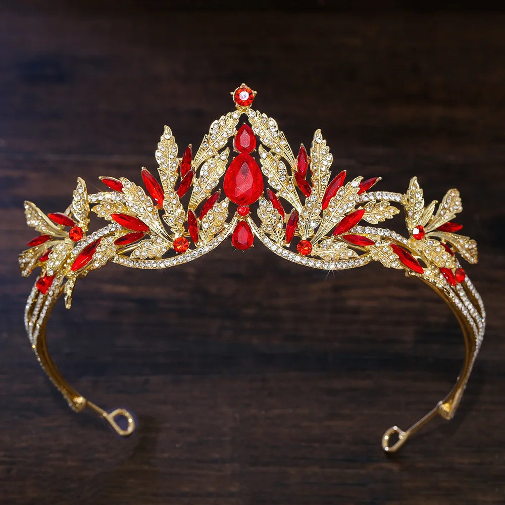 Gold rhinestone tiara headband with red teardrop crystals and sparkling leaf accents