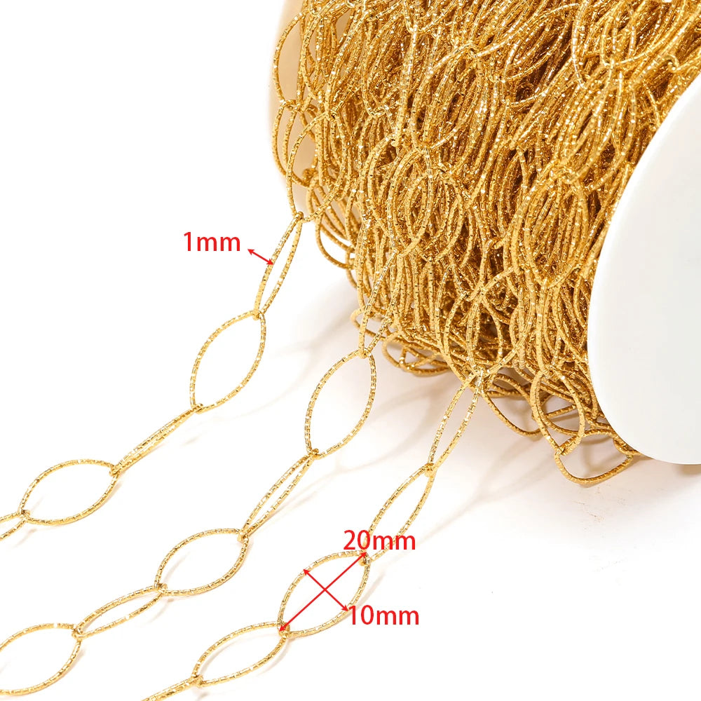 Close-up of gold hollow oval chain links, thin ring texture for jewelry crafts