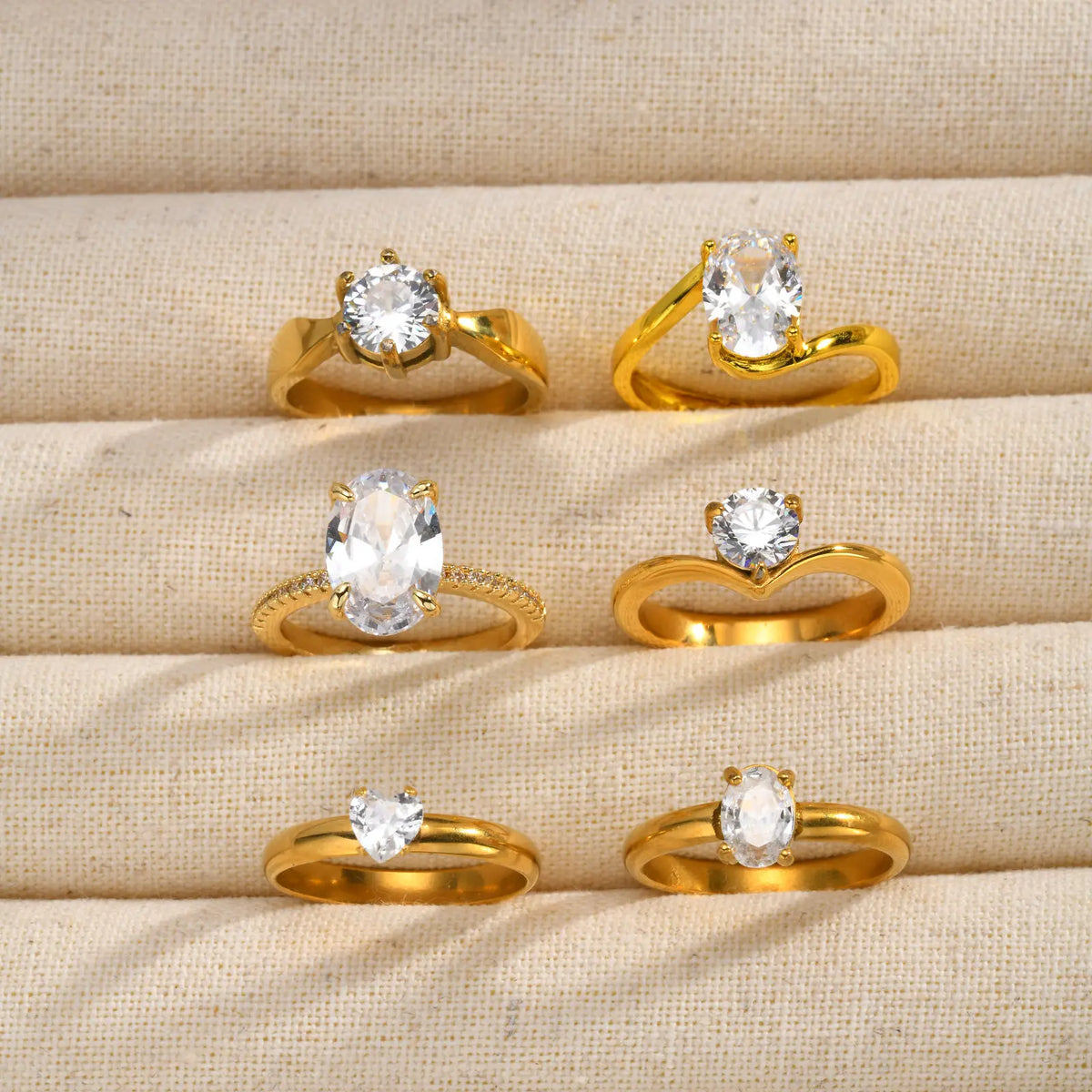 Set of gold-tone open-band rings with round cubic zirconia stones