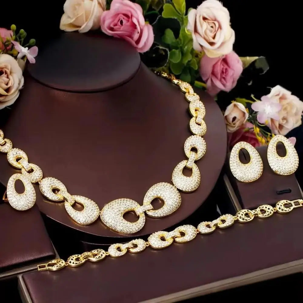 Gold-tone zirconia chain link necklace with matching bracelet and earrings