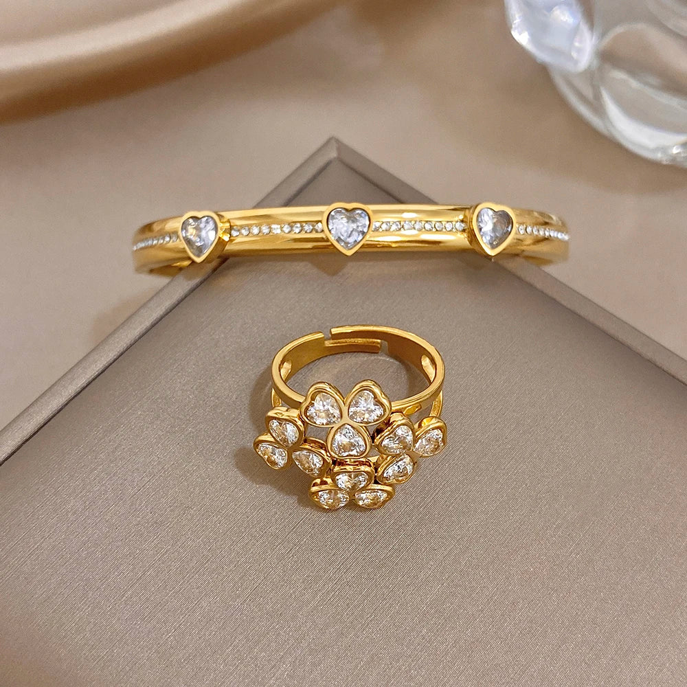 Gold-tone heart-stone bangle bracelet with flower cluster ring and clear gems
