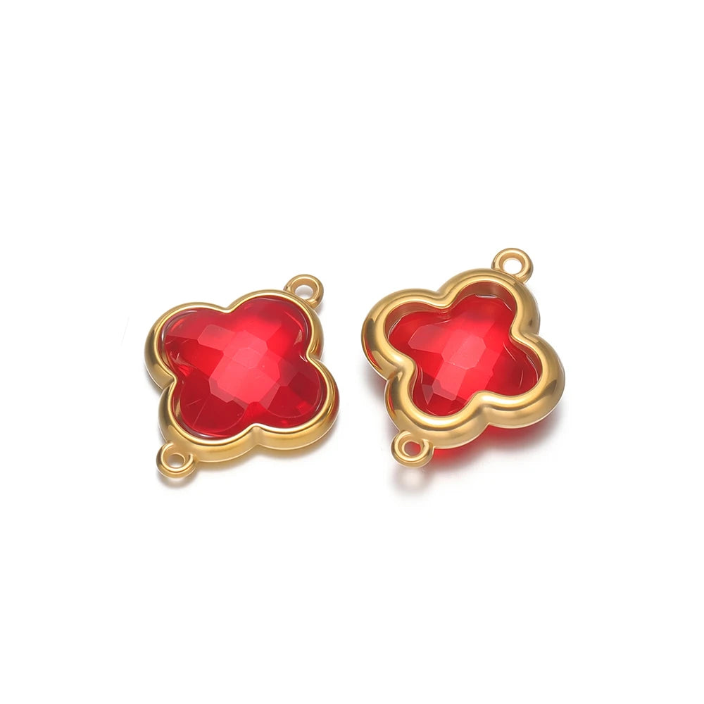 Four-leaf clover glass charm pendant with red gem and gold-tone loop