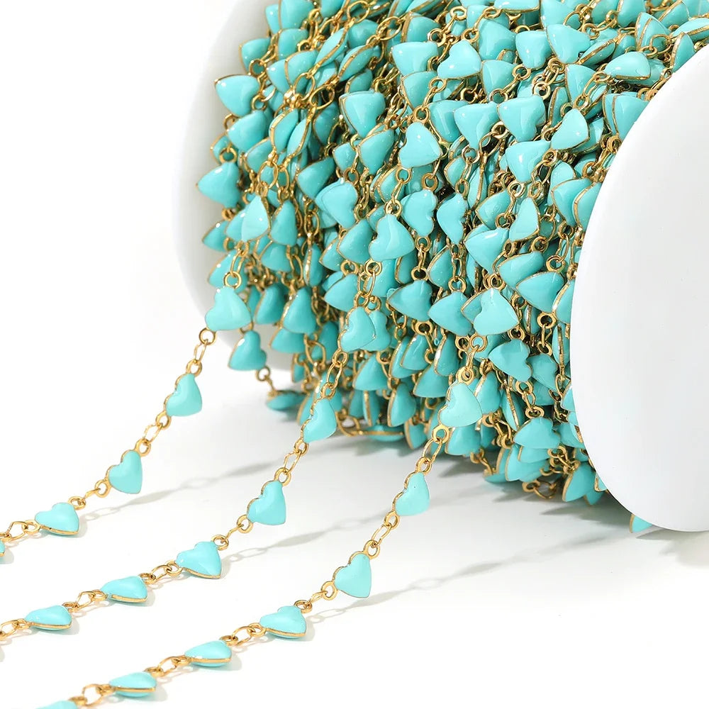 Turquoise enamel heart charm chain with gold-tone links and linked heart drops
