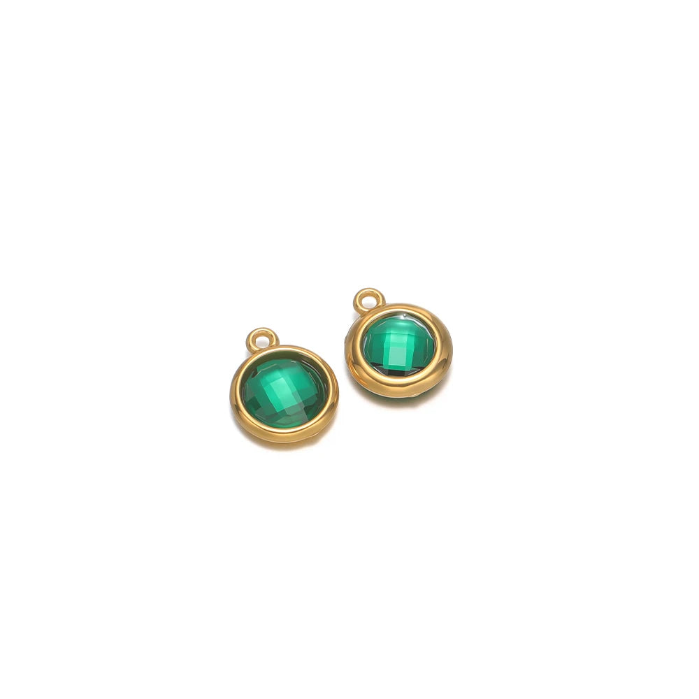 Round faceted glass charm pair in green with gold-tone metal loops