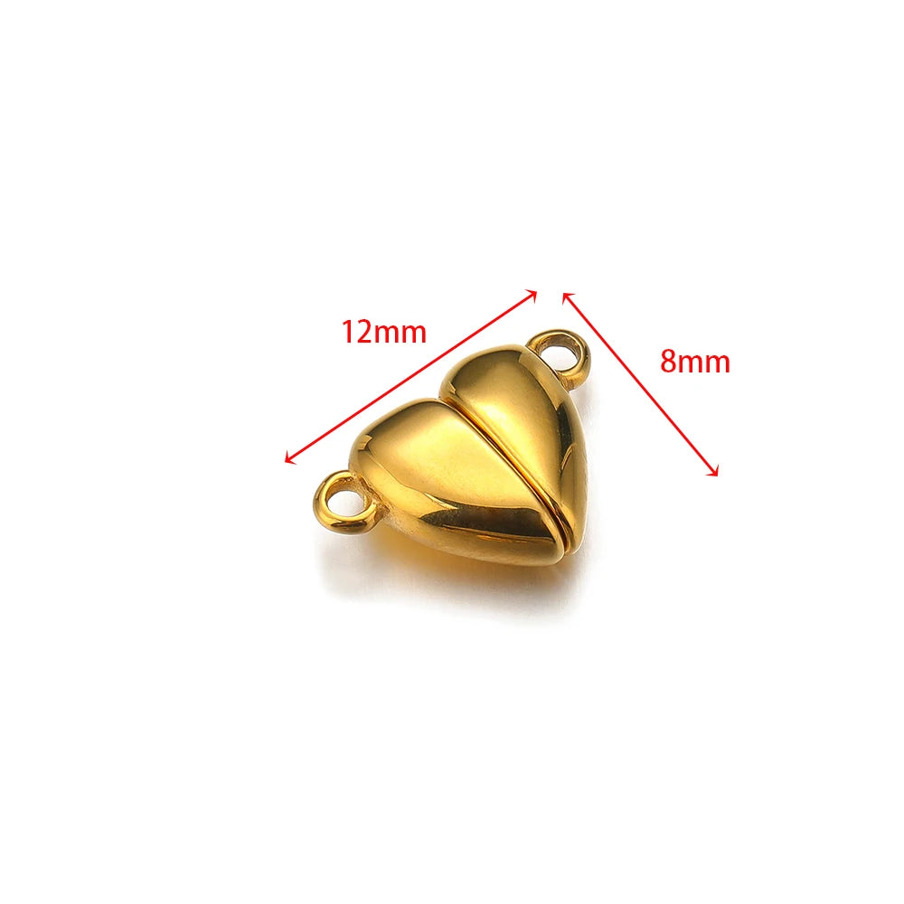 Gold heart-shaped magnetic clasp connector, 12mm by 8mm, with two attachment loops.