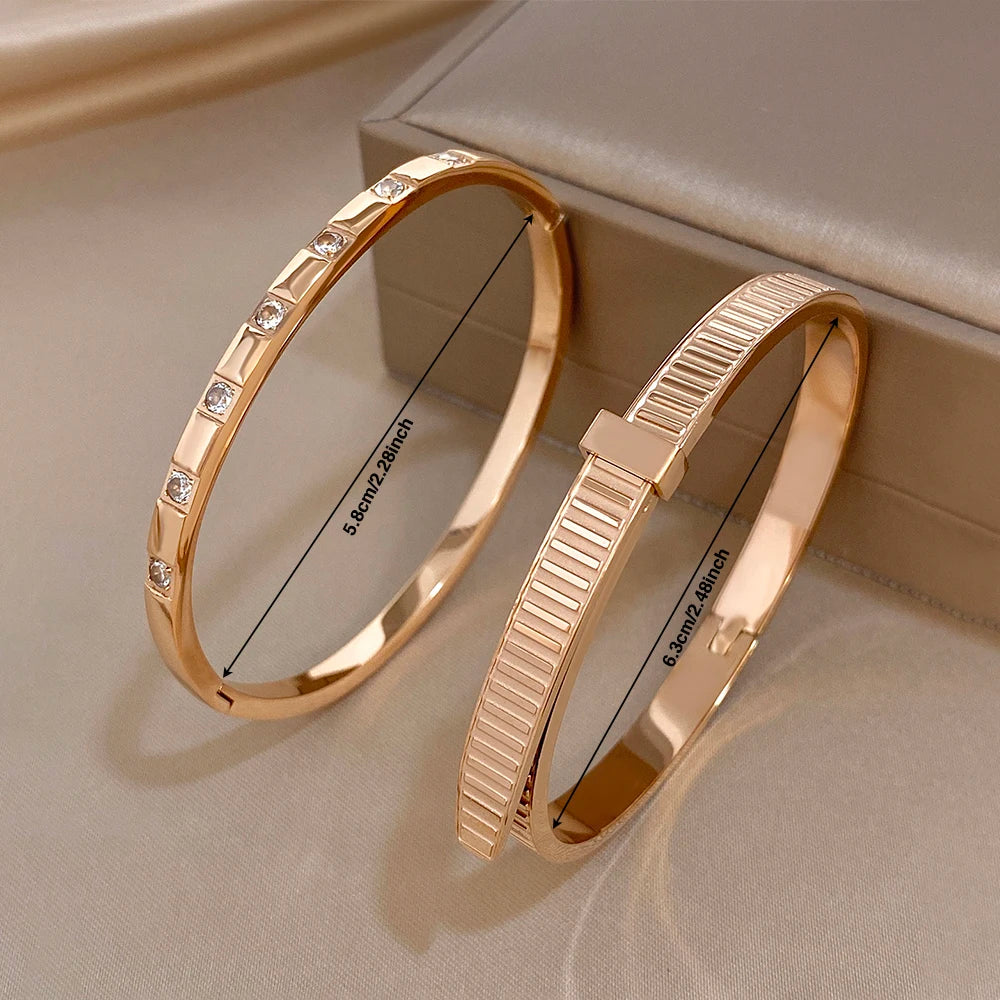 Rose gold stainless steel cuff bangles with clear stones and geometric ribbed detail