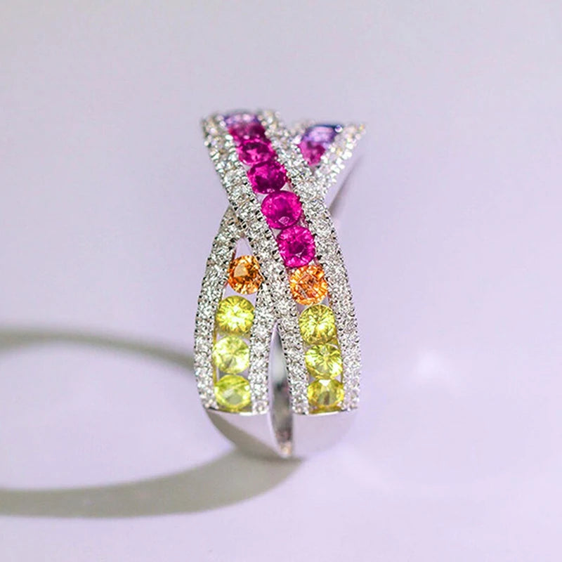 Rainbow CZ cross ring with pink, orange, and yellow stones
