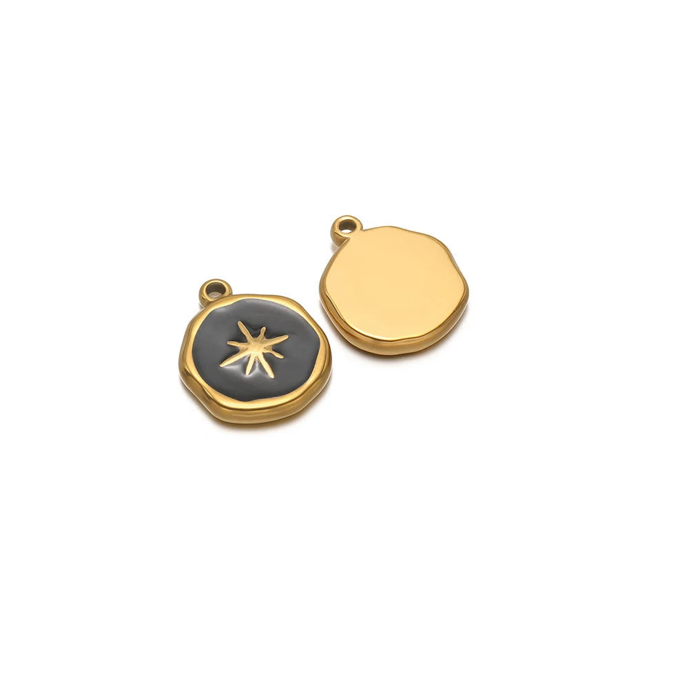 Round enamel charm pendant with gold border, black star design and plain gold charm
