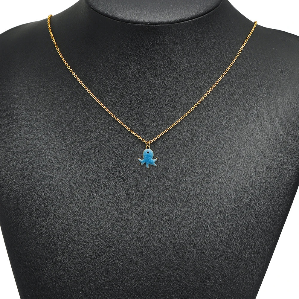 Blue enamel octopus charm pendant on a gold-tone chain necklace