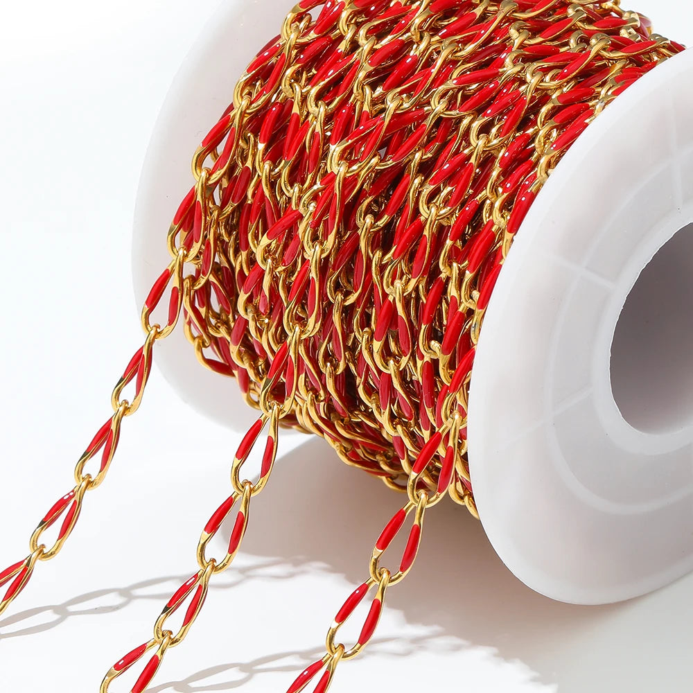 Twisted enamel chain red and gold oval links on a spool with hanging chain