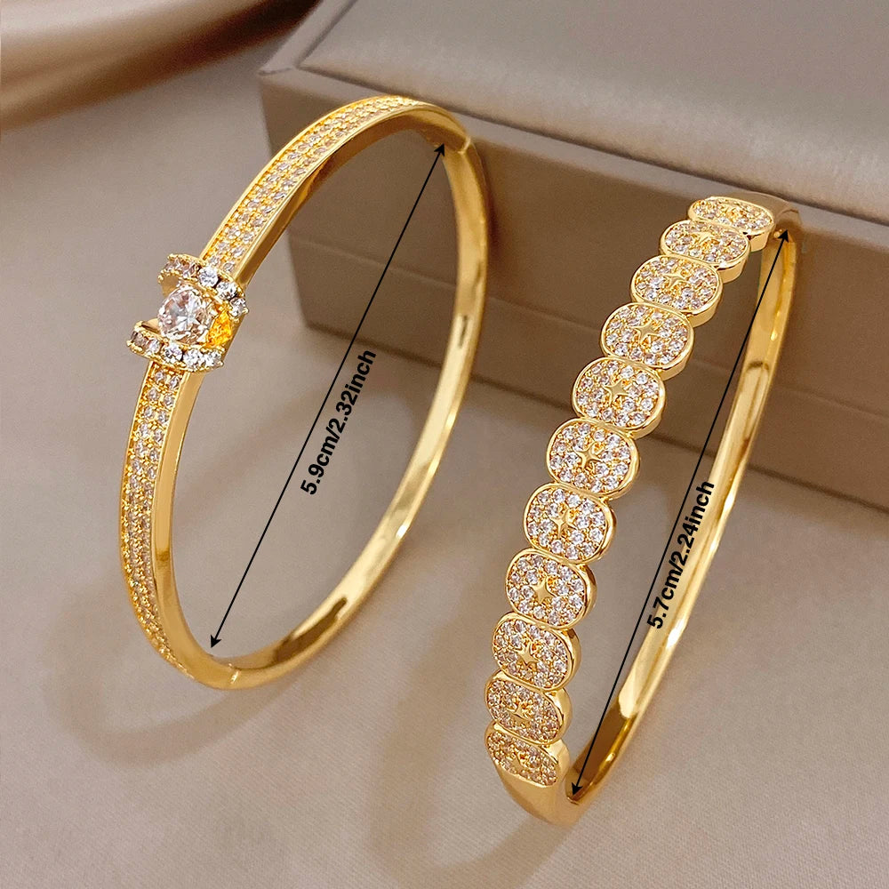 Gold plated rhinestone bangle bracelets, one star motif and one round motif