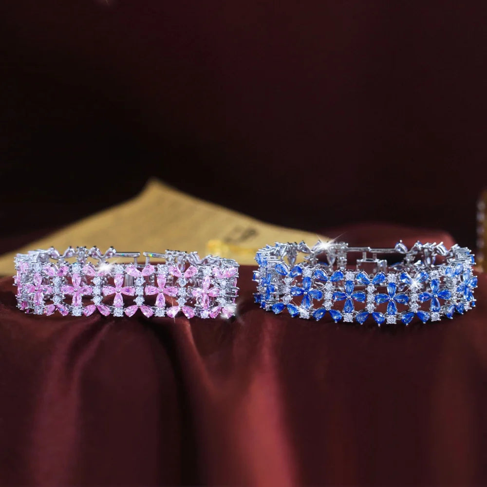 Pink and blue floral crystal tennis bracelets shown fastened into loops