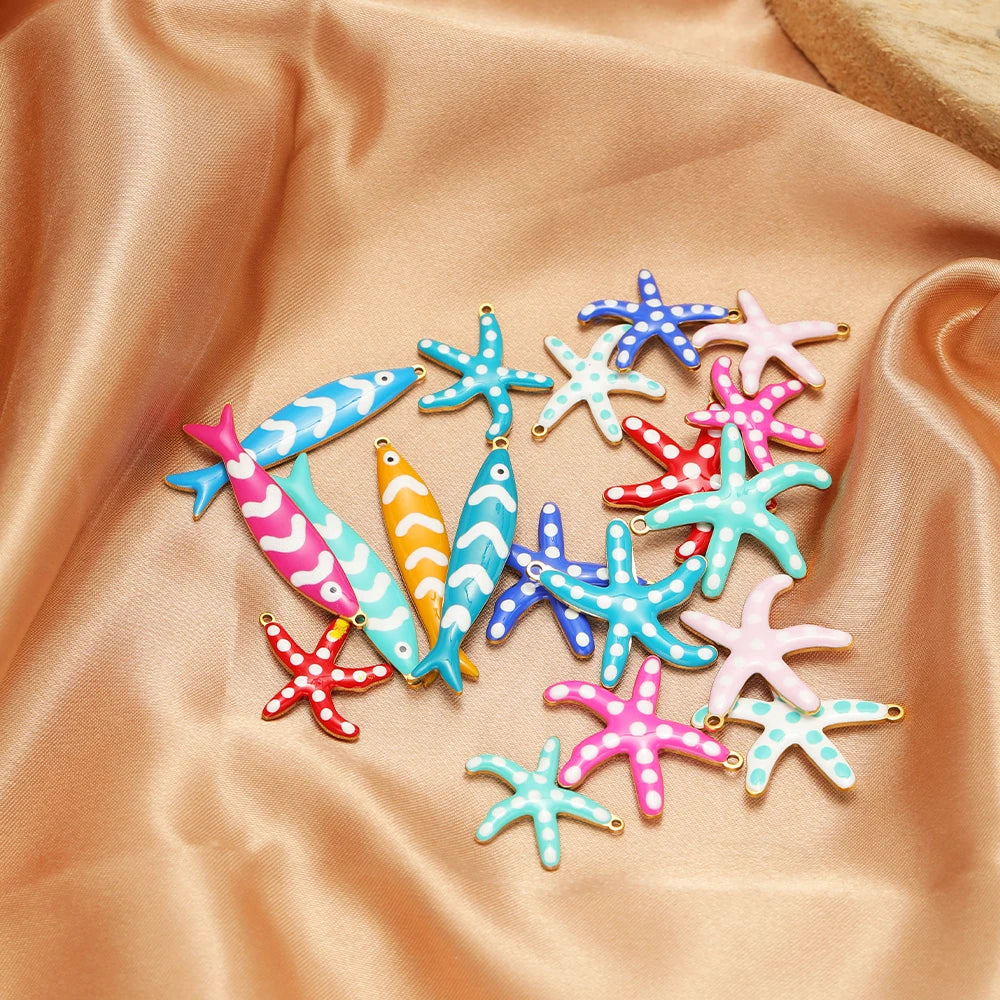 Assorted colorful fish and starfish enamel charms with gold-tone loops