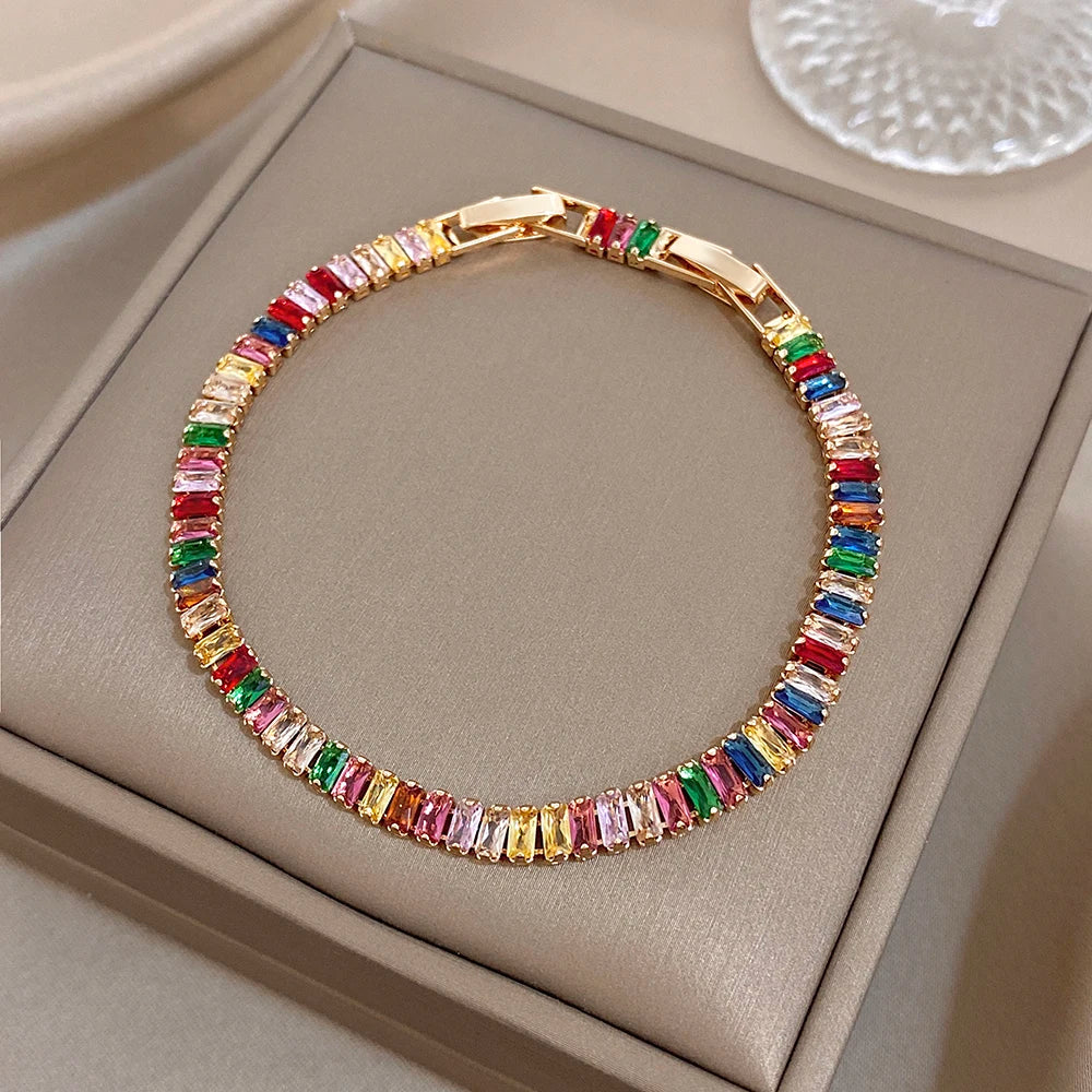 Gold-tone rainbow zircon tennis bracelet with colorful stone row and hinge clasp