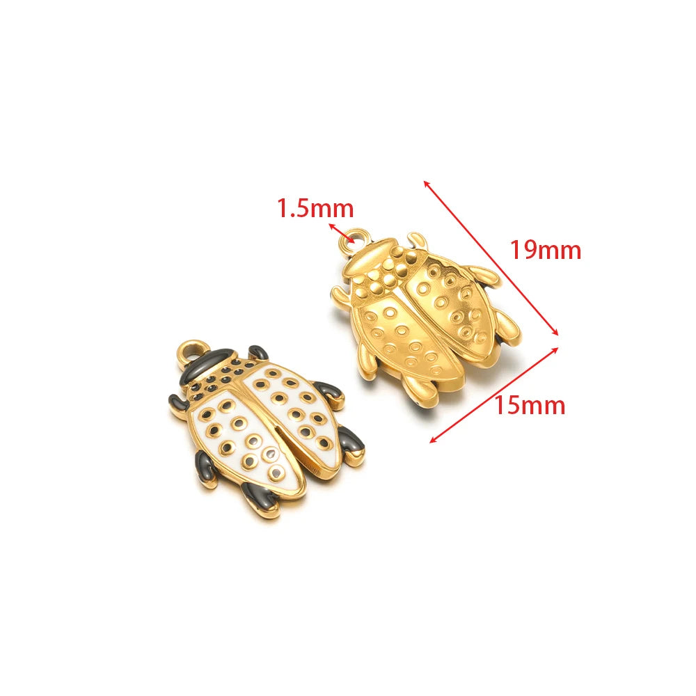 Gold-tone and black enamel beetle charm pendants with raised dot accents.
