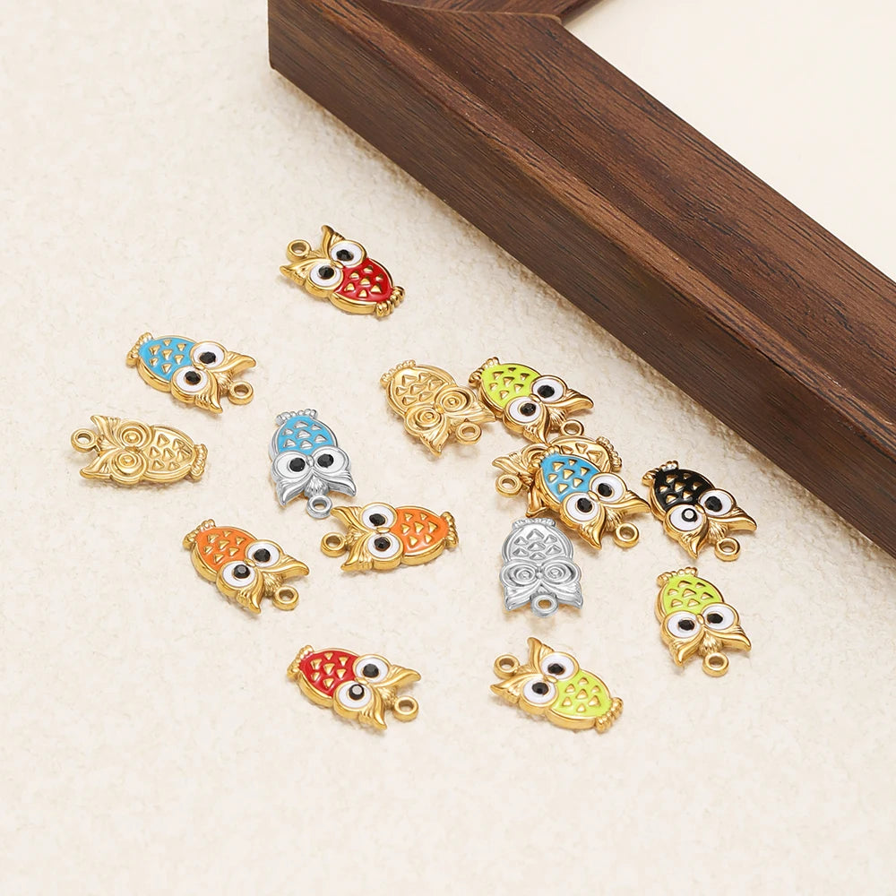 Enamel owl charm pendants with gold-tone frames in mixed blue, red, green, and orange