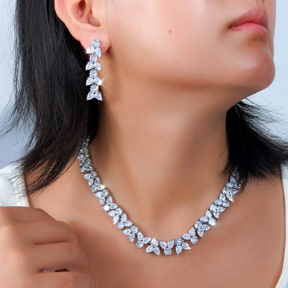 Clear leaf-shaped zirconia necklace and long matching earrings shown worn