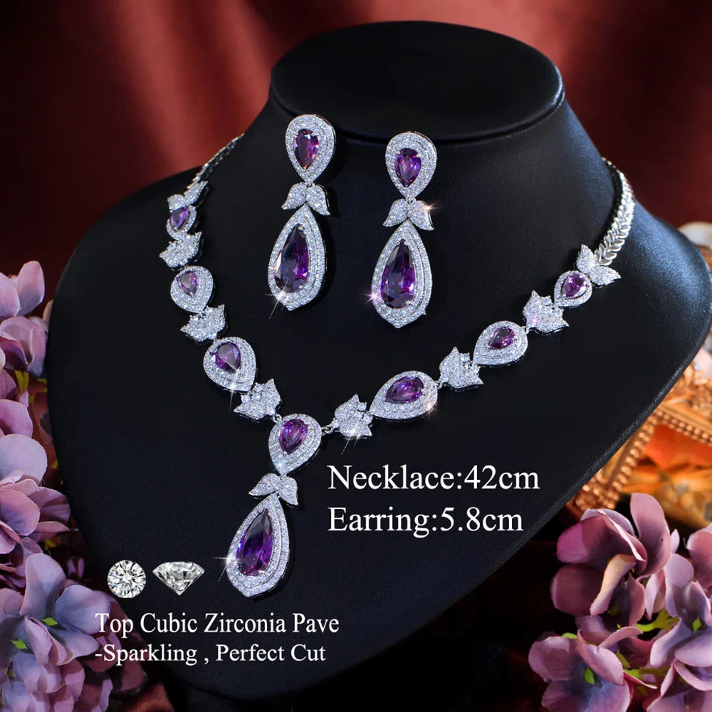Purple crystal necklace and earrings set with teardrop stones; necklace and earring lengths shown