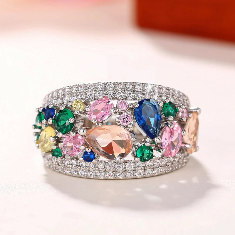 Silver-tone multicolor cubic zirconia ring with pink, blue, and green stones, front view.