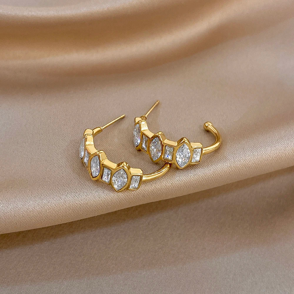 Gold-tone hoop earrings with stacked zirconia square stone segments