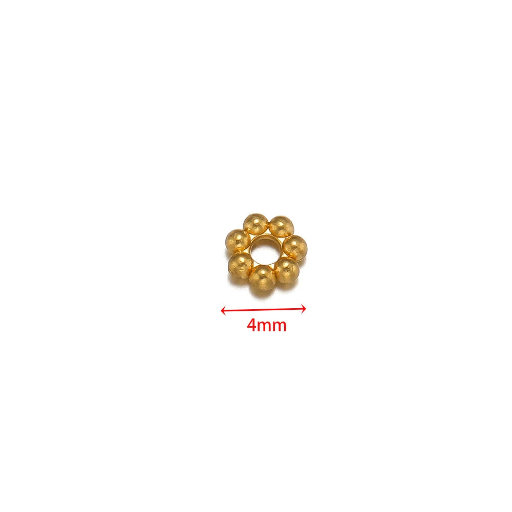 Gold flower spacer bead, single piece shown with 4mm size marker.