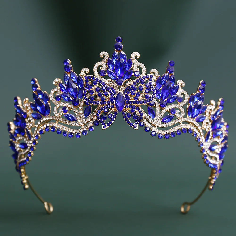 Blue rhinestone butterfly tiara with ornate filigree and crown centerpiece