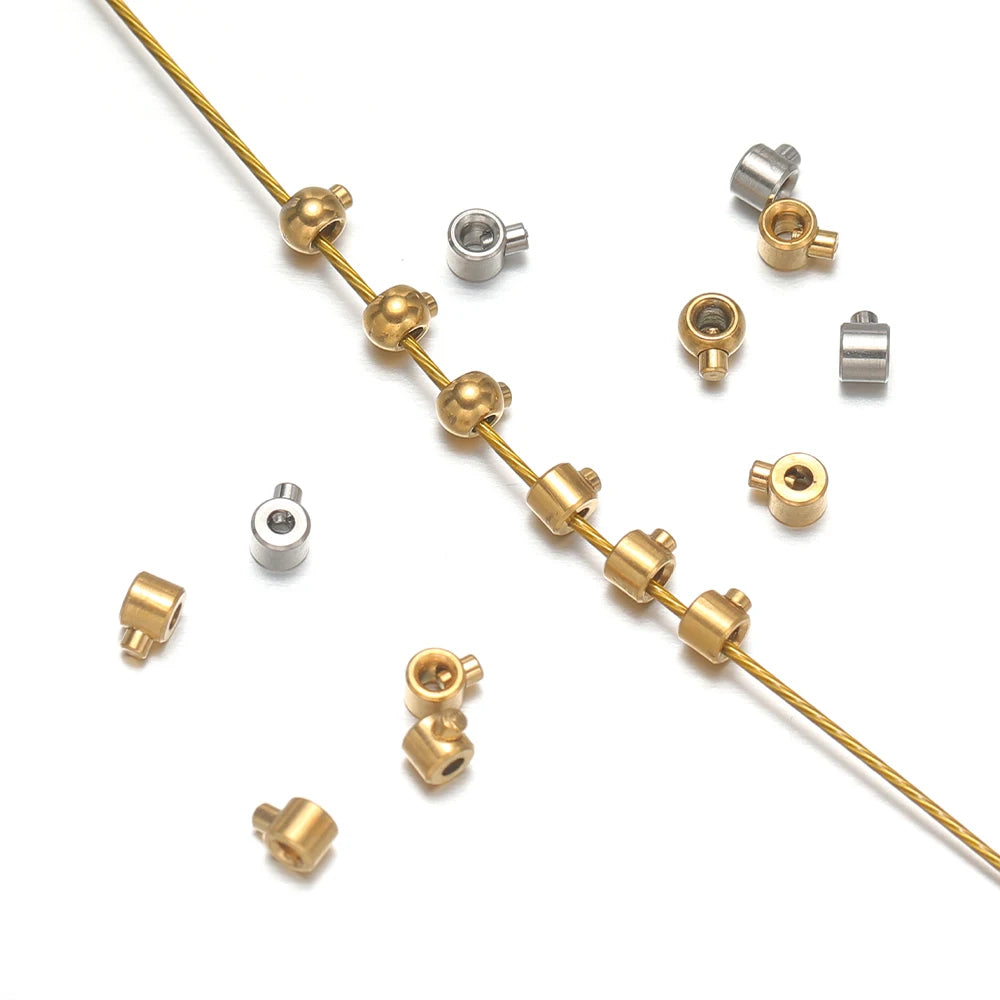 Crimp end bead stoppers attached to gold beading wire, mixed gold and silver set