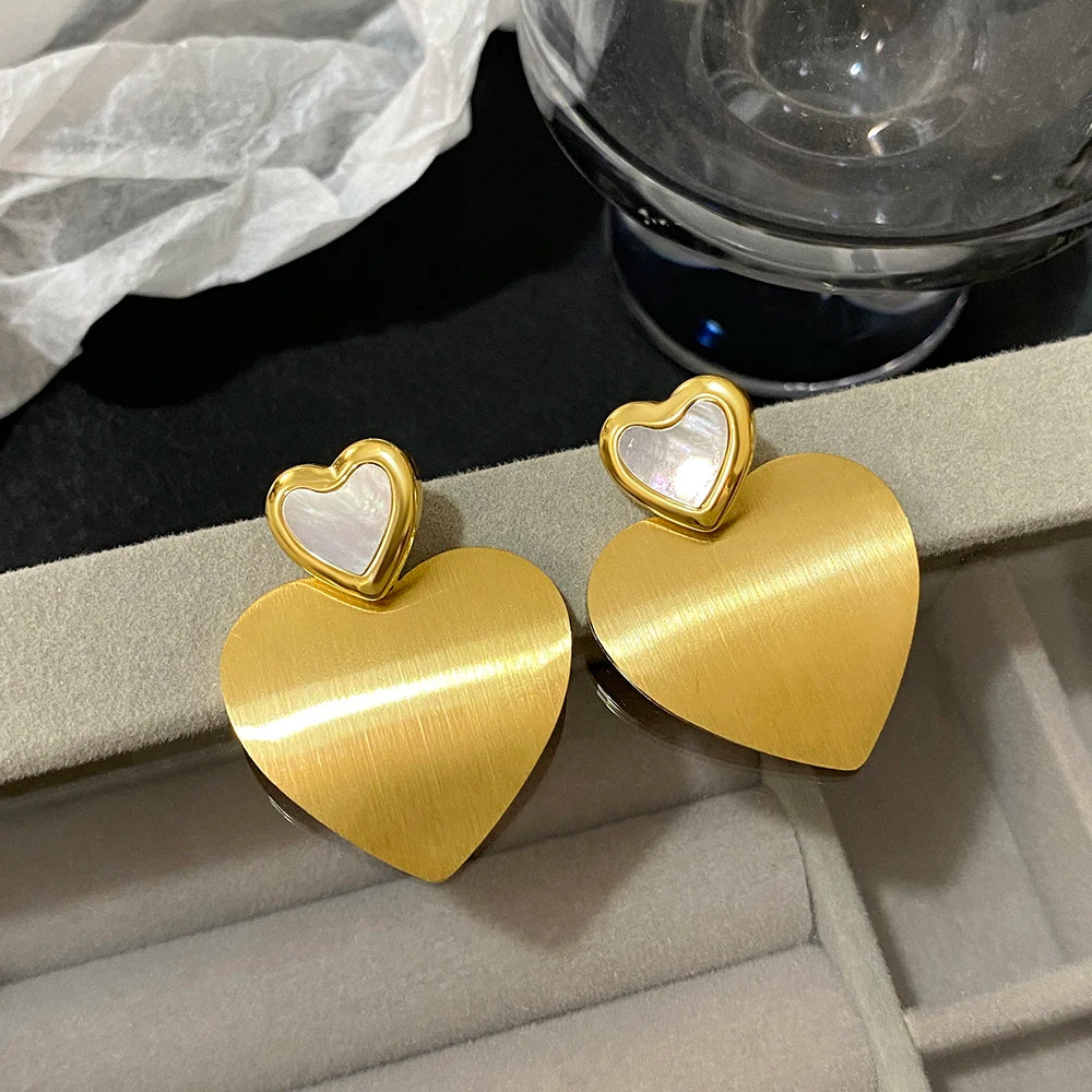 Gold heart drop earrings with brushed finish and pearly heart studs