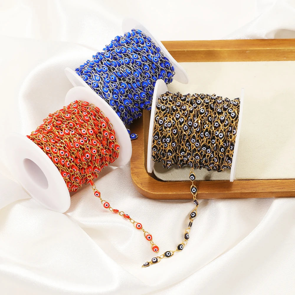 Evil eye bead chain rolls in red, blue, and gold tones with oval eye beads