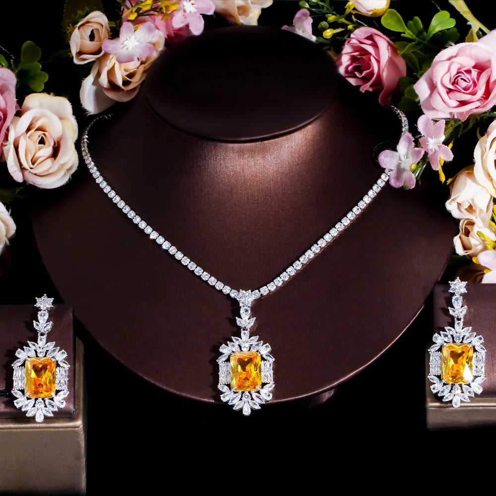 Cubic zirconia jewelry set with yellow square stones, silver-tone necklace and matching earrings