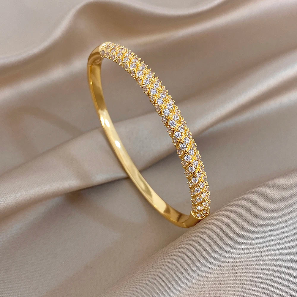 Gold plated cuff bangle with micro inlaid zircon stones