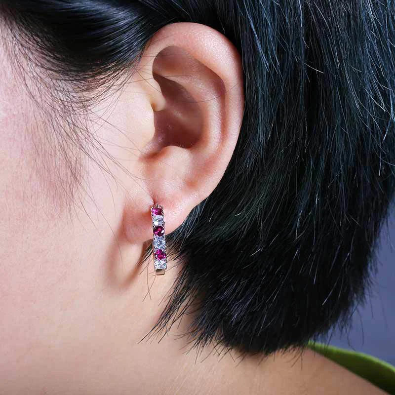Small circle hoop earrings with pink gemstone row and hinged back