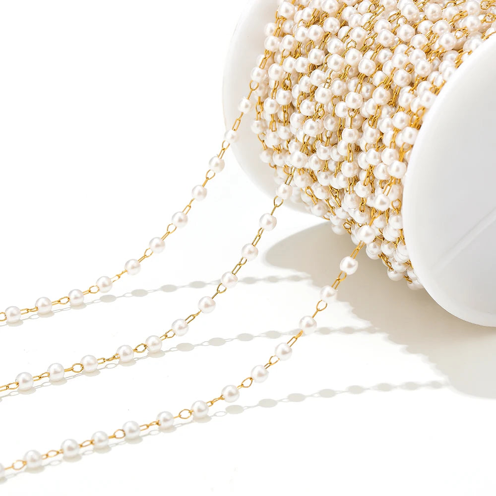White imitation pearl chain with gold-tone links, 3mm bead spacing for jewelry making