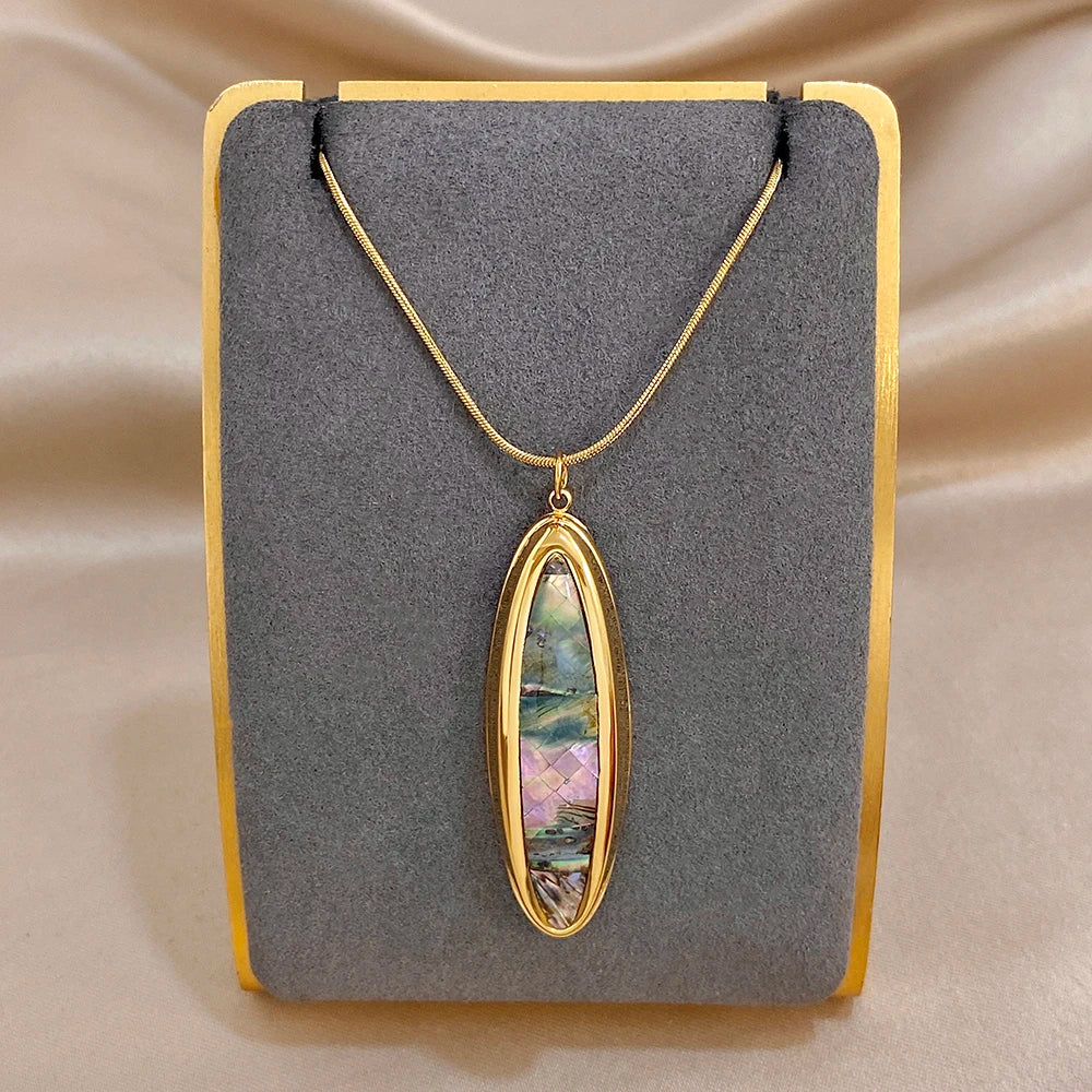 Gold oval abalone shell pendant necklace with thin snake chain, gold-tone setting