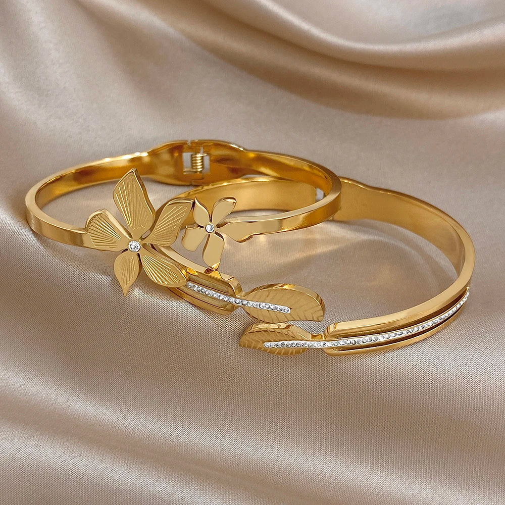 Gold-plated stainless steel cuff bracelets with leaf and flower zircon accents
