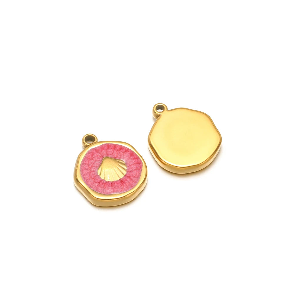 Pair of enamel ocean charms: yellow shell charm and pink seashell charm with gold fish