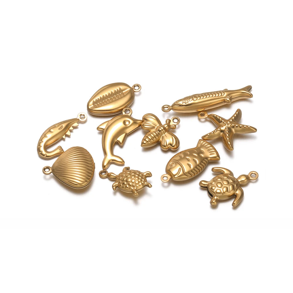 Gold-toned ocean animal hollow charms set with fish, dolphin, sea turtle, starfish
