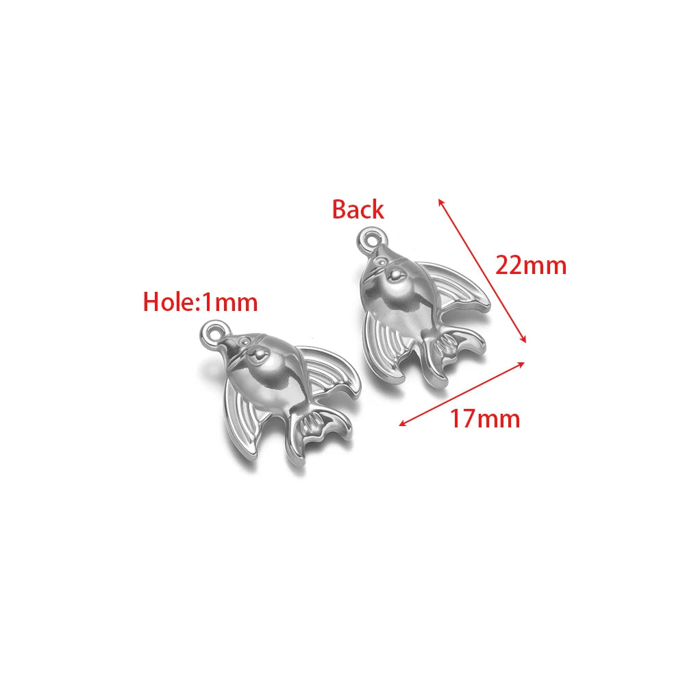 Silver fish charm pendant pair, 3D metallic dolphin-like fish shape with loop bail
